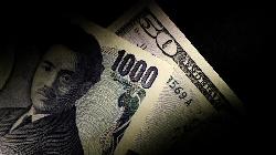 Dollar edges lower, while yen slumps after BOJ's surprise inaction