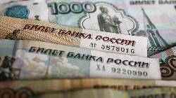 Rouble firms past 60 vs dollar despite eased capital controls