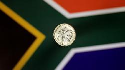 UPDATE 1-South Africa's rand creeps up as risk sentiment holds, stocks slip