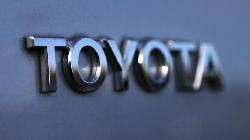 Tesla, Toyota spar with Ford, UAW over EV tax bill