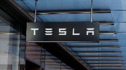 Analysis-Tesla's rivals scrap for thin slices of US EV sales
