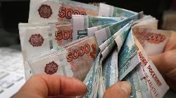 Russian rouble pares losses vs dollar in volatile trade
