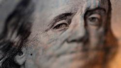 Dollar drops as Fed's Powell repeats disinflation comments, seen less-hawkish