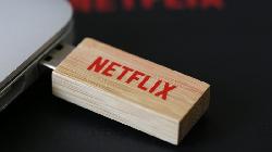 Netflix shares rise for second day as market climbs