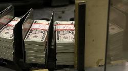 Dollar largely flat; central bank meetings in focus