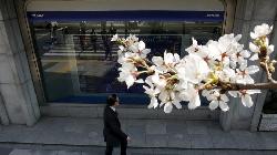 Nikkei ends higher; eyes on global trade, BOJ meeting 