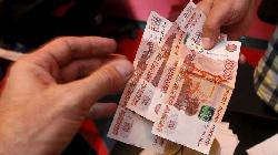 Rouble steadies, stocks down ahead of return of some foreign investors