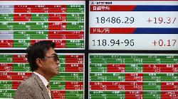 Japan shares slip from 30-year high on profit booking, pandemic-hit stocks rise