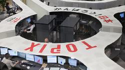 Nikkei up as large cap stocks rebound; growth woes cap gains