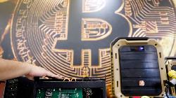 Bitcoin Drops as Safe-Haven Debate Continues