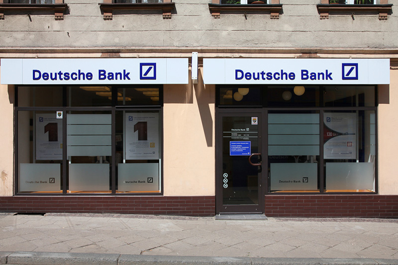 &copy; Reuters A man walks past Deutsche Bank offices in London