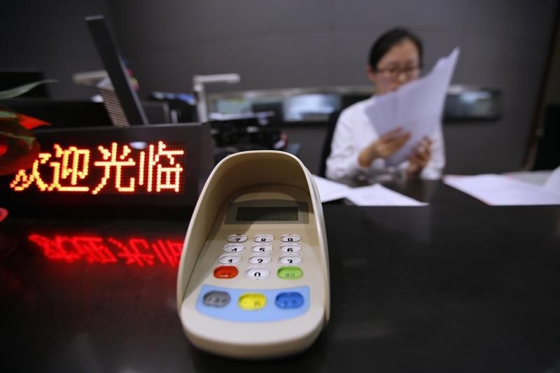 China to tighten liquidity risk management on smaller banks: regulator
