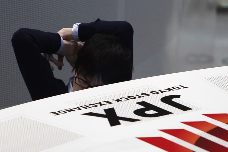 Japanese shares slump as virus surge stokes slowdown worries