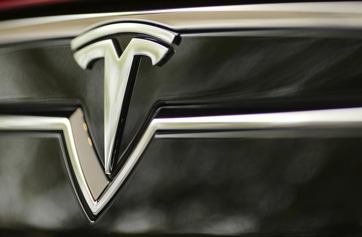 Stocks - Tesla Soars in Premarket on Upgrade; Groupon Tumbles