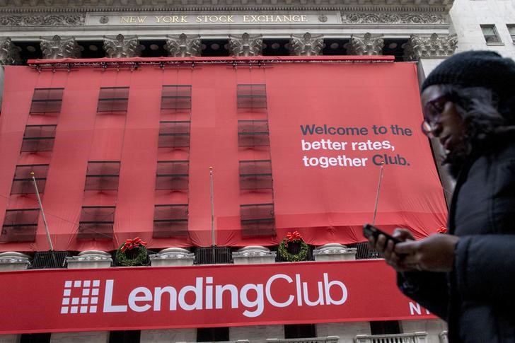 © Reuters. File photo of a woman passing by a Lending Club banner on the facade of the the New York Stock Exchange
