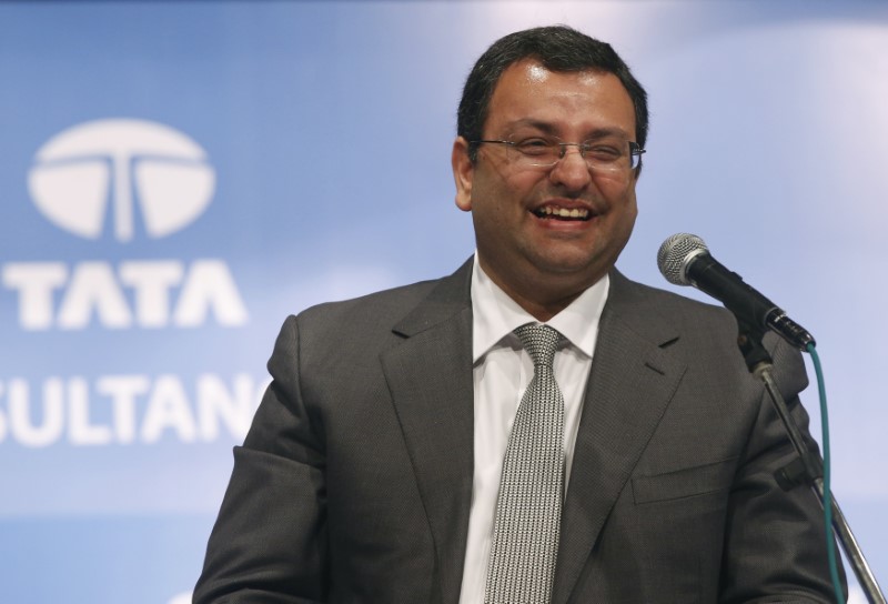 © Reuters. Mistry, chairman of Tata Group, smiles during the TCS annual general meeting in Mumbai