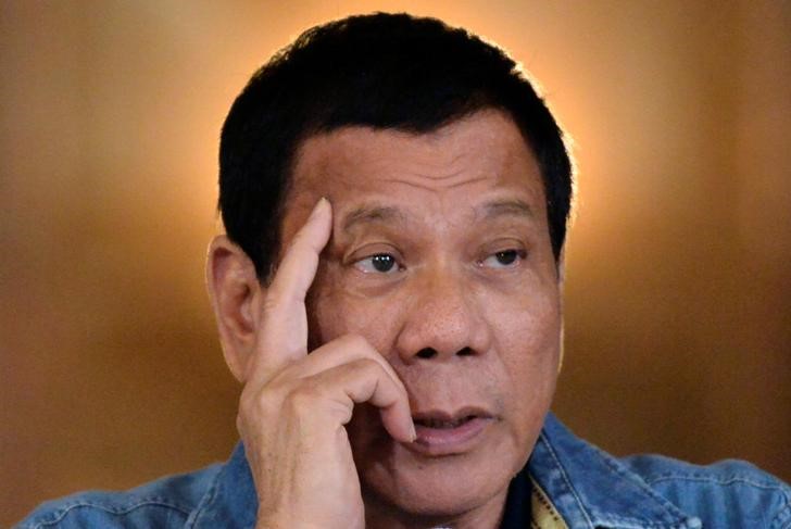 &copy; Reuters.  Philippines' Duterte says will review minister's decision to close mines