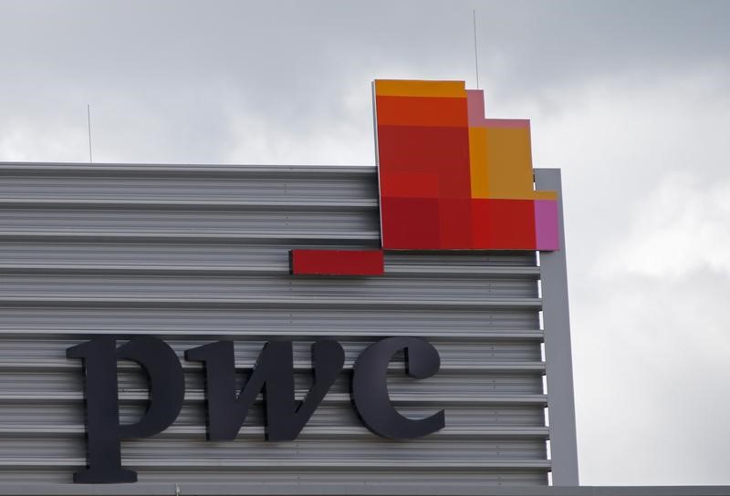 © Reuters. FILE PHOTO: The logo of Price Waterhouse Coopers is seen at its Berlin office in Berlin, Germany, September 20, 2019. REUTERS/Wolfgang Rattay/File Photo