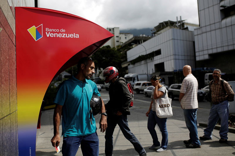 &copy; Reuters.  As many Venezuela bondholders stampede, some joust for advantage