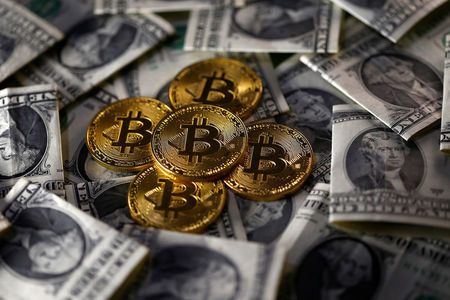 Bitcoin recua para US$ 56 mil após anúncio do FED. Binance Coin, SAND e MANA sobem 35%