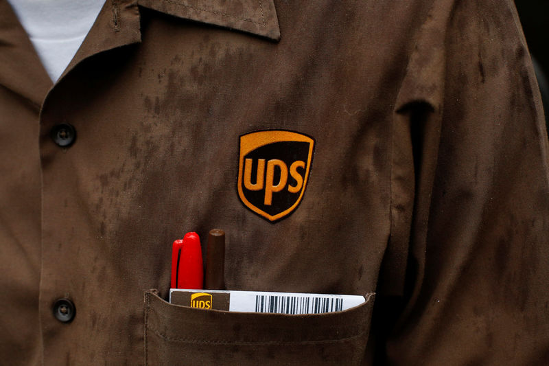 © Reuters. The company logo for United Parcel Service (UPS), is displayed  on a screen at the NYSE in New York