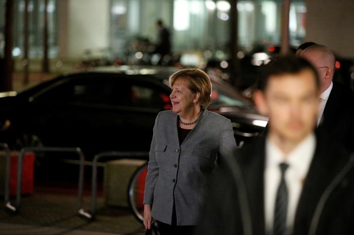 &copy; Reuters.  Weakened Merkel begins fourth term beset by challenges