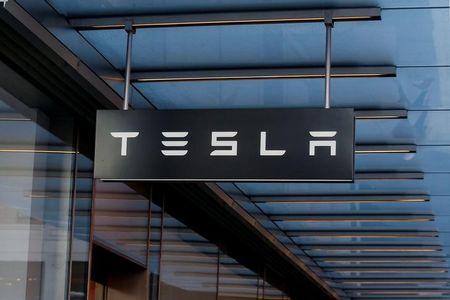 Cathie Wood’s ARK buys more Tesla stock, sells Coinbase