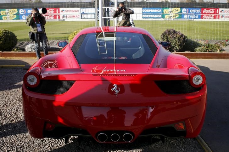 Ferrari stock downgraded to hold, price target lowered to $425