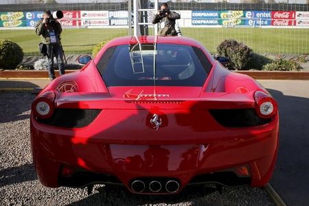 Ferrari stock downgraded to hold, price target lowered to $425