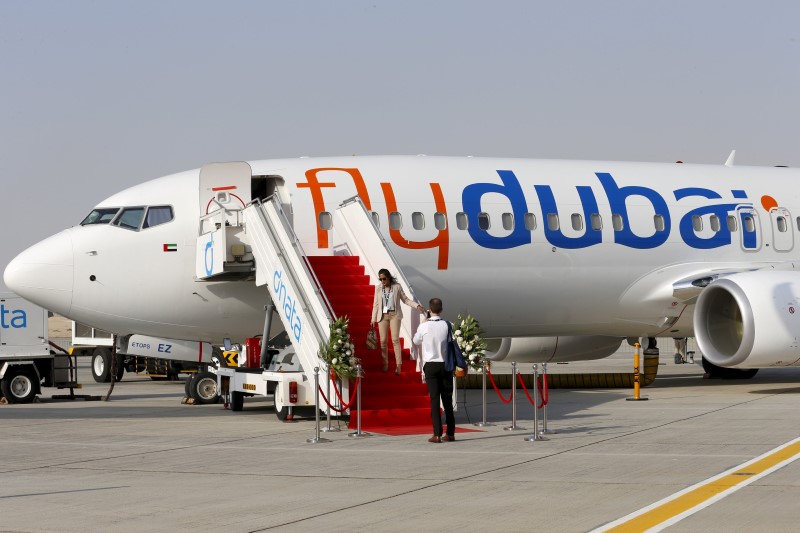 © Reuters. A Boeing 737 MAX aircraft bearing the logo of flydubai is parked at a Boeing production facility in Renton