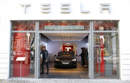 Midday movers: Tesla, Coinbase, and more