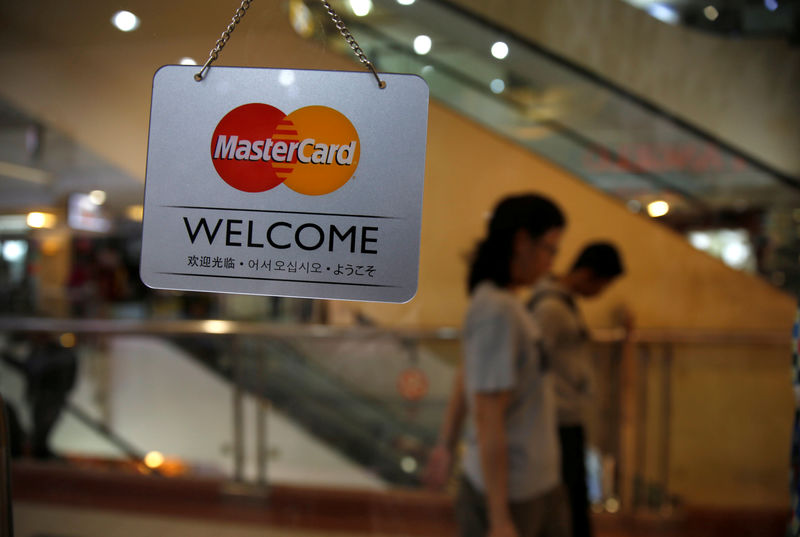 Visa and Mastercard Estimates Cut on International Exposure