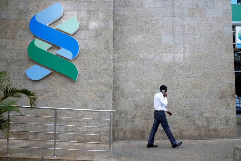 &copy; Reuters.  Standard Chartered results all about bad debts and bid talk