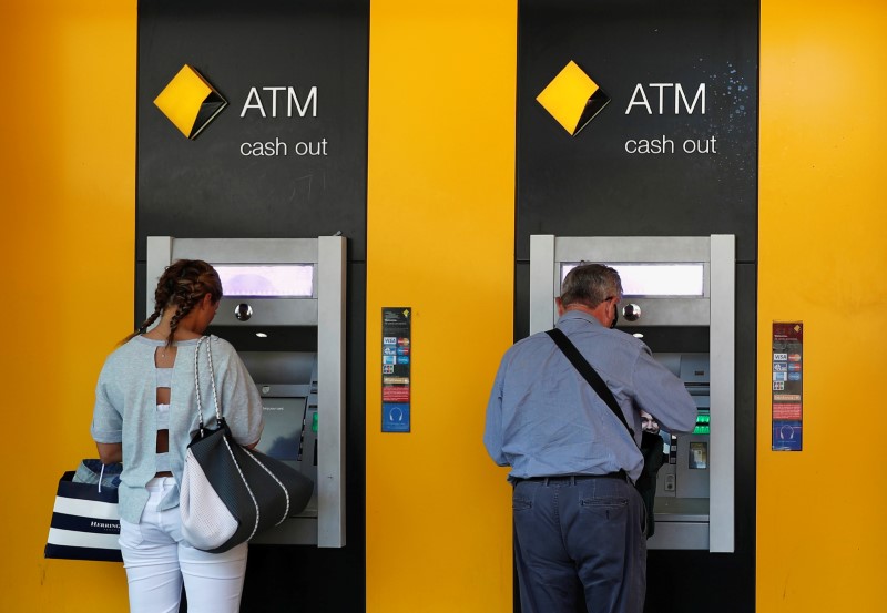 Australian banks use bloated cash balances to reduce debt