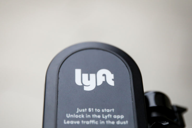 UBS downgrades Lyft to Neutral as survey shows drivers prefer Uber