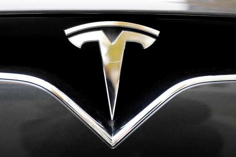 &copy; Reuters Would You Rather Get $45K Of Dogecoin Or A Brand New Tesla Model 3?