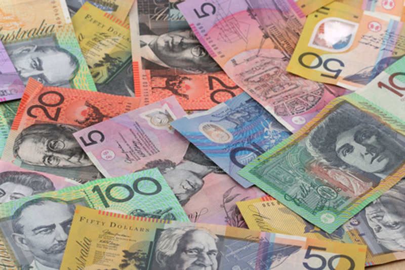 Dollar Edges Lower; Australian Dollar Soars After Rate Hike