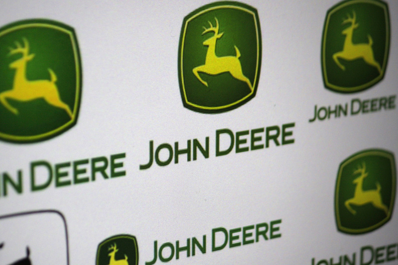 UPDATE 3-Deere's shares surge after earnings beat estimates