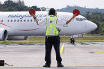 Asia's airlines ramp up flights, offers as tough COVID travel curbs ease