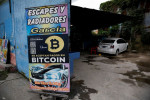 Bitcoin tumbles to new 18-month low