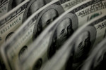 Dollar set for weekly loss as investors brace for slower Fed rises