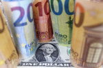 Dollar edges up against euro after U.S. inflation data