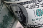 Dollar loses ground after Fed raises rates, forecasts more hikes