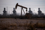 Oil rises on Red Sea attacks, lower US production as Trump tariffs loom