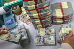 Dólar oscila perto da estabilidade à espera de novidades sobre tarifas