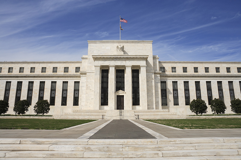 Fed Keeps Rates on Hold Despite Signs of Improving Economic Recovery