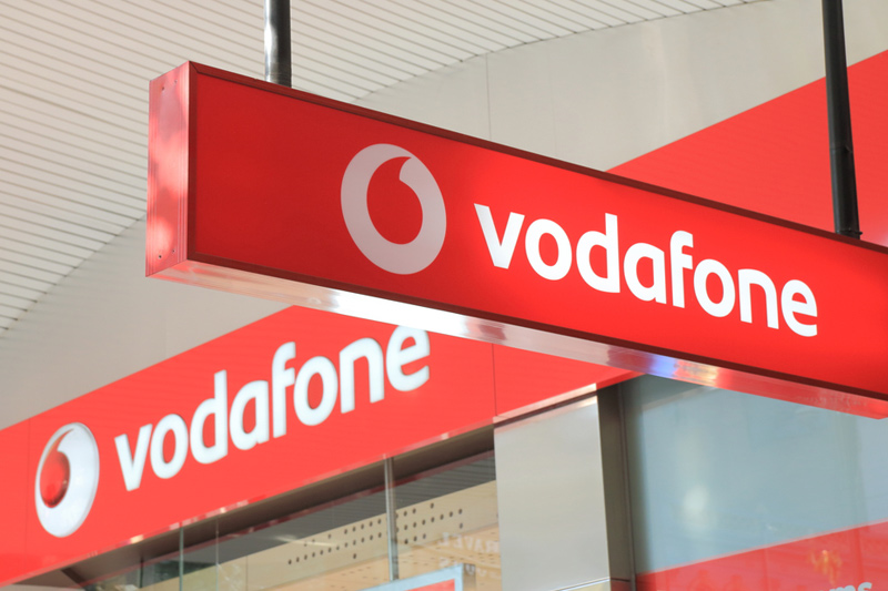 Vodafone climbs as government green lights merger with Three