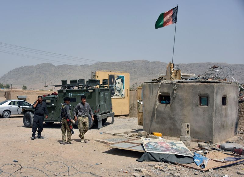&copy; Reuters. FILE PHOTO: Afghan security forces inspect the site of a car bomb attack in Kandahar province, Afghanistan, July 6, 2021. REUTERS/Stringer   