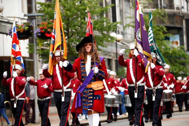 &copy; Reuters. Band members take part in unionist Twelfth celebrations in Belfast, Northern Ireland, July 12, 2021. REUTERS/Jason Cairnduff
