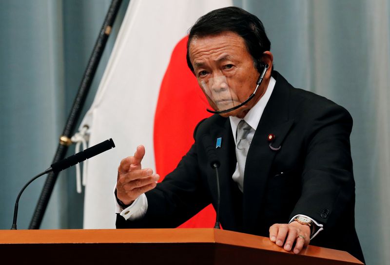&copy; Reuters. FILE PHOTO: Japan's newly-appointed Finance Minister Taro Aso speaks at a news conference in Tokyo, Japan, September 16, 2020. REUTERS/Kim Kyung-Hoon 